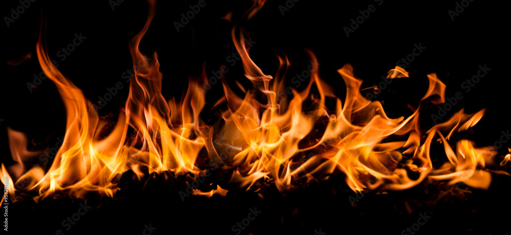 Fire flames on black background. Blaze fire flame texture. Fire flame with copy space. Blaze fire flame textured background. Flames on black background.