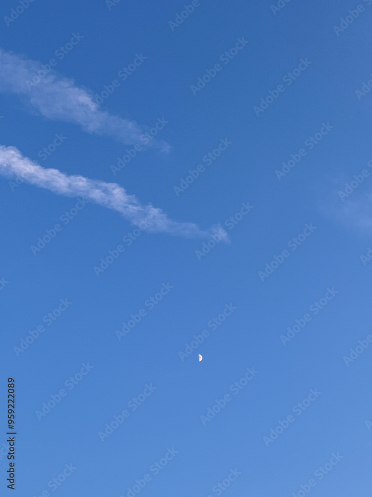 Blue sky with white airplane streaks across Blue sky with white airplane streaks across