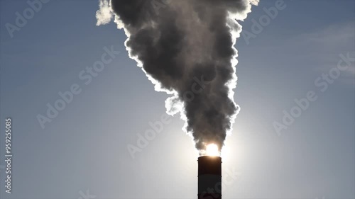 Wallpaper Mural Industrial factory chimney releasing thick smoke into the atmosphere at sunset. Ideal for projects focused on pollution, environmental issues, climate change, and industrialization. Torontodigital.ca