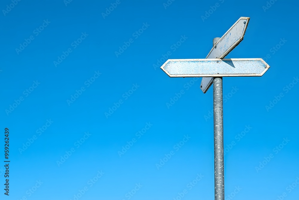 Blank Signpost Against a Clear Blue Sky Blank Signpost Against a Clear Blue Sky