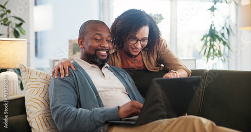 Couple, laptop and relax in house for decision, movie and bonding on sofa with subscription service. Man, woman and chill in living room for film search, love and streaming with remote control click