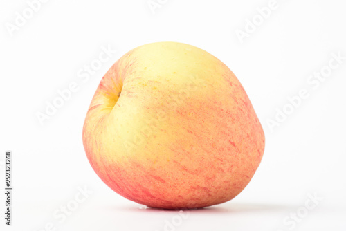 Fresh ripe apple with tiny water drops on white background