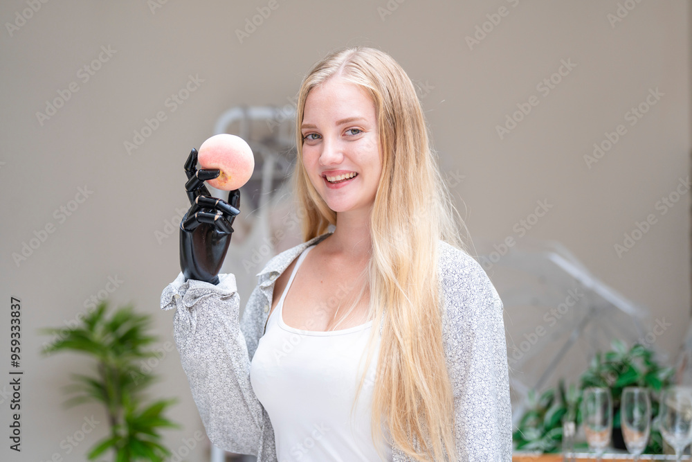 © ultramansk - A young woman is using a robotic prosthetic arm attached to her body. She controls her hand to pick up objects food fruits and apples. The woman tries to control the smart arm in her home.