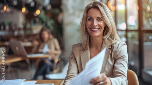 Fototapeta Naklejka Na Ścianę i Meble -  Smiling mature business woman hr holding cv document at job interview. Happy mid aged professional banking manager or lawyer consulting client sitting at workplace in corporate office meeting.