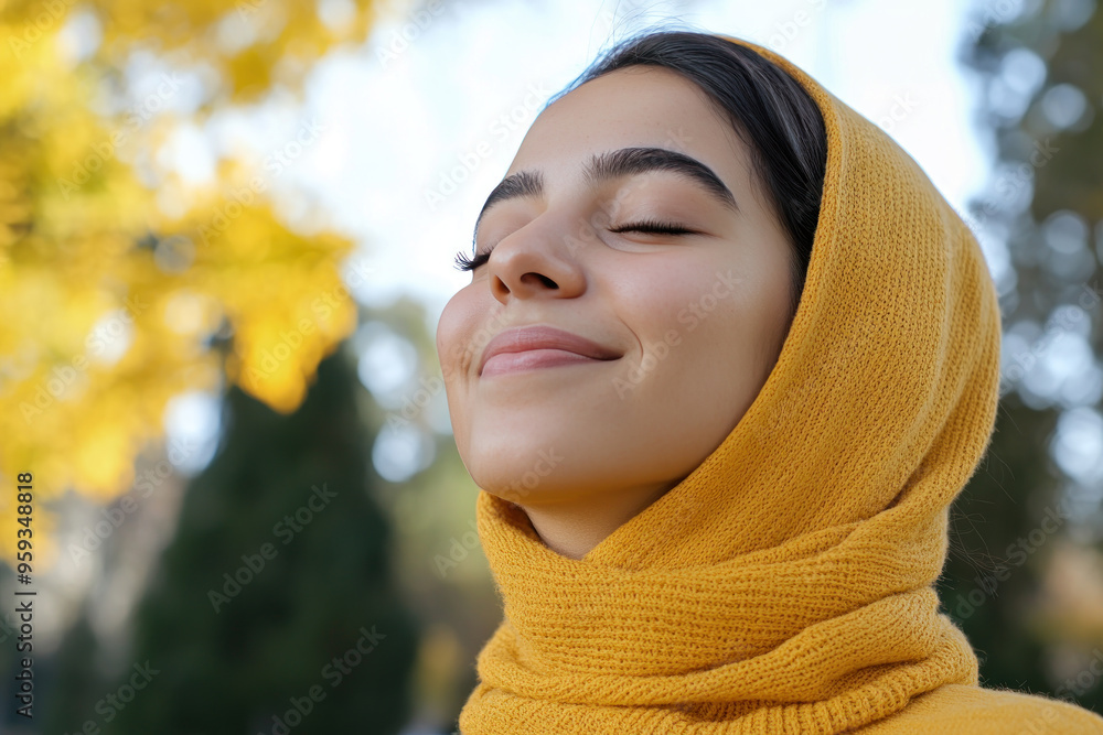 Arabian woman wearing yellow knitted sweatshirt in autumn park at sunny day Arabian woman wearing yellow knitted sweatshirt in autumn park at sunny day
