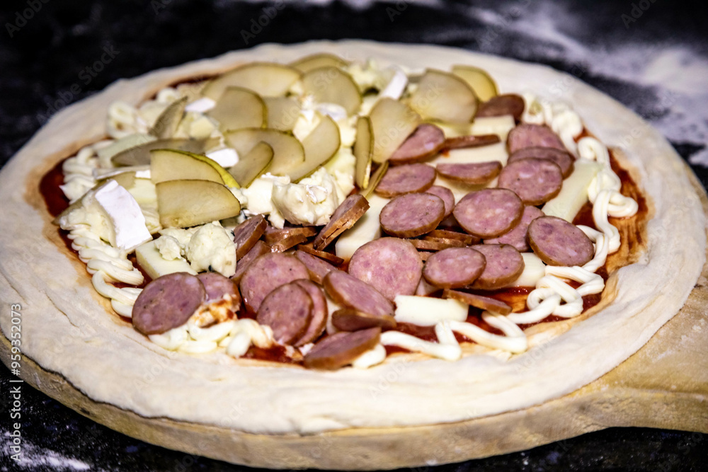 Pizza half pear with gorgonzola and brie cheese and half pepperoni with onions Pizza half pear with gorgonzola and brie cheese and half pepperoni with onions