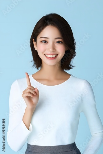 An Asian beauty model gesturing against an isolated background, perfect for a business or commercial wallpaper with blank space for writing.