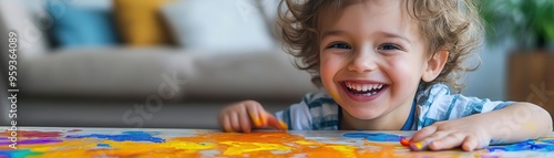 A child smiling while unintentionally spilling paint on a table, illustrating the joy of happy accidents, close up, family creativity, whimsical, overlay, living room backdrop photo