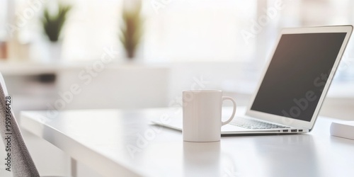 Wallpaper Mural Blurred modern home office interior with laptop and coffee cup on a white table, close-up panoramic view, ideal for web design or graphic illustration backgrounds. Torontodigital.ca