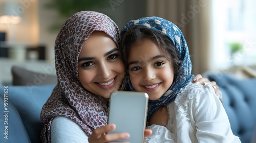 Happy Middle Eastern Young Mom And Daughter Making Selfie Photo Via Phone Hugging On Sofa At Home Selective Focus On Smartphone Screen With Shot Of Happy Mother And Kid Girl Shallow De : Generative AI photo