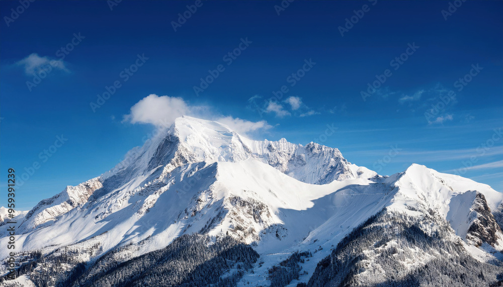 Obraz premium Wide angle view landscape of white snowy peak in mountain range with clear blue sky. Nature concept for lifestyle product background