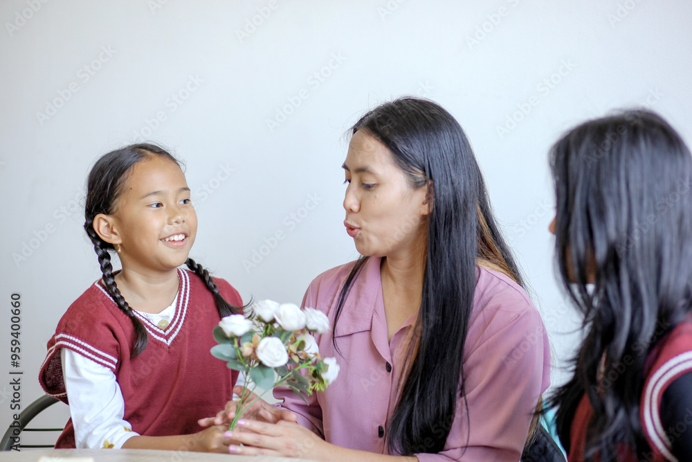 Cheerful Asian Family Little Girl Giving Flower And Mother Receiving. Happy Mothers Day Cheerful Asian Family Little Girl Giving Flower And Mother Receiving. Happy Mothers Day