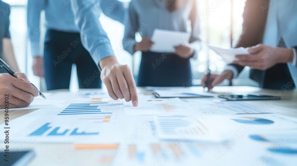Business Team Meeting Analyzing Data and Charts Business Team Meeting Analyzing Data and Charts