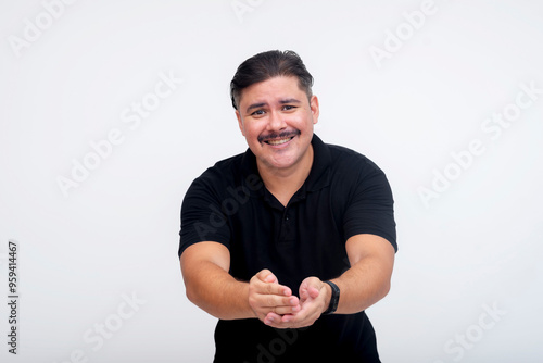 A middle aged man eagerly introducing himself, offering both hands for a handshake. Trying to please, ingratiate and flatter someone. Set against a white background. photo