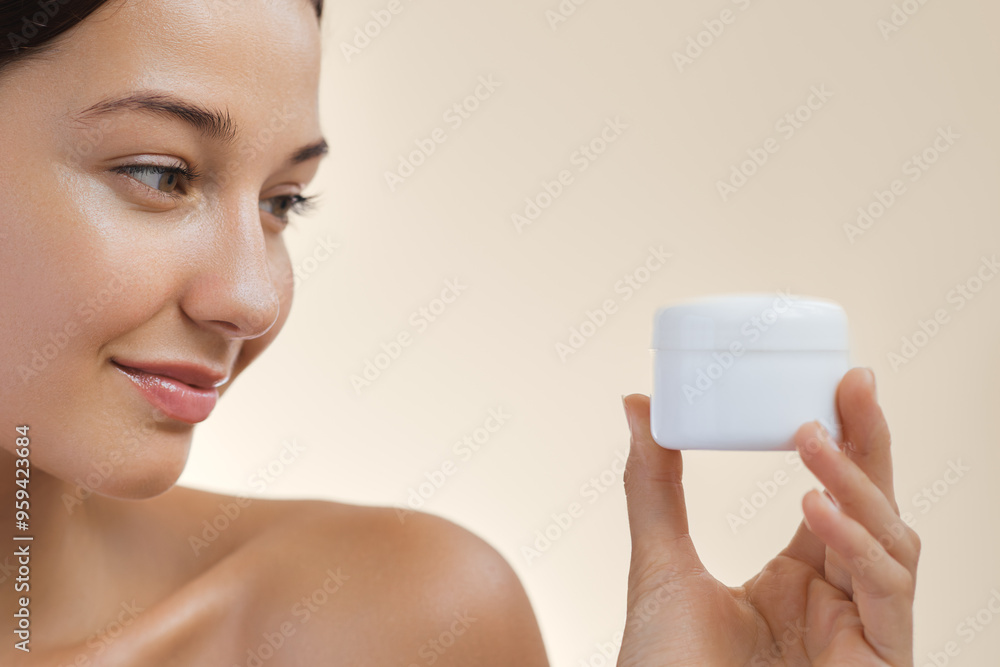 Woman Smiling Holding Skincare Cream Jar Woman Smiling Holding Skincare Cream Jar