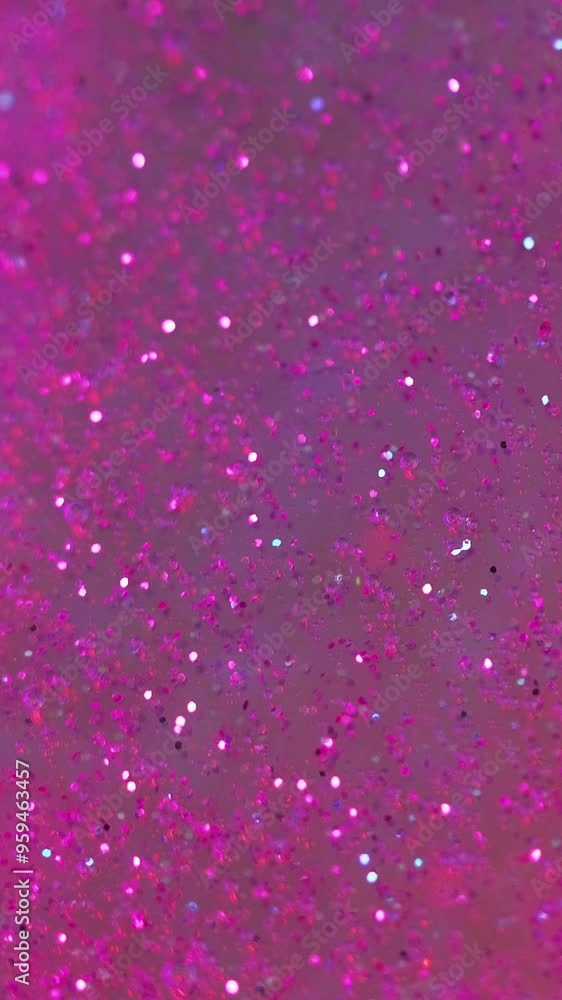 Vertical video. Glitter gel drip. Fluid spill. Defocused pink violet color transparent sparkling particles texture oil paint wave flow motion abstract art background. Vertical video. Glitter gel drip. Fluid spill. Defocused pink violet color transparent sparkling particles texture oil paint wave flow motion abstract art background.