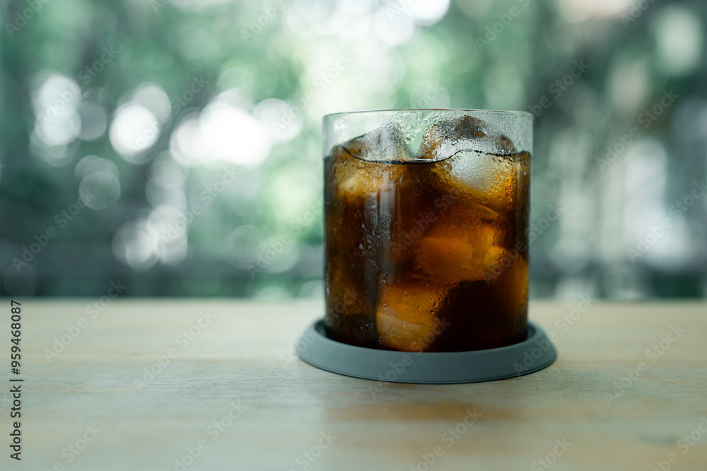 Morning cup of ice black coffee on wood table Morning cup of ice black coffee on wood table