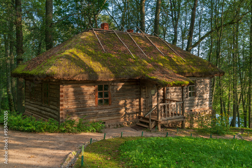 Traditional Russian log bathhouse in the Trigorskoye Estate of the Pushkin Natural Landscape Museum-Reserve on a sunny summer day, Pushkinskiye Gory, Pskov Region, Russia photo