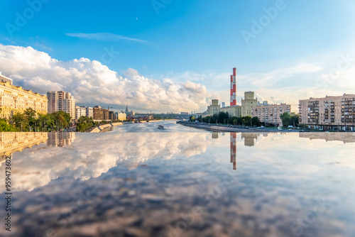 View of Berezhkovskaya Embankment in Moscow with reflection on a mirror stone surface photo