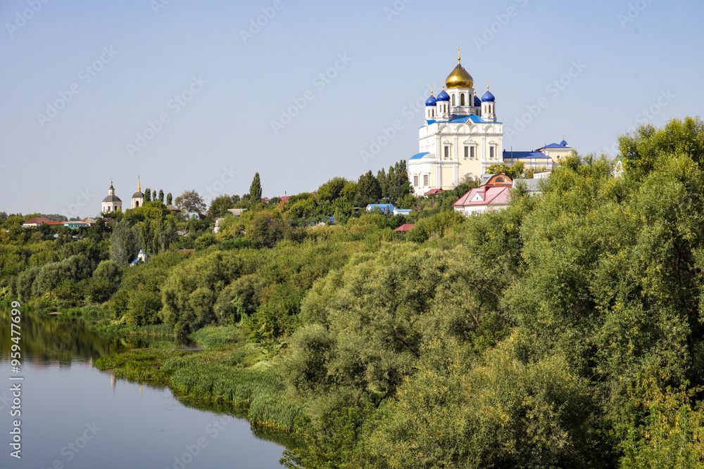 A beautiful landscape with a river and a church in the background A beautiful landscape with a river and a church in the background