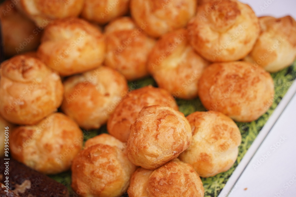 Sweet pastries with different fillings are laid out on the table. Sweet pastries with different fillings are laid out on the table.