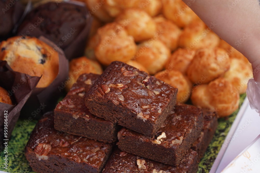Sweet pastries with different fillings are laid out on the table. Sweet pastries with different fillings are laid out on the table.