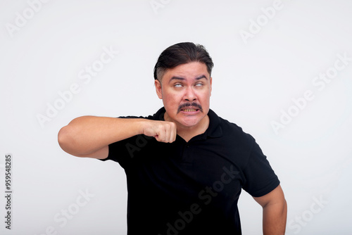 A middle aged man makes the undertaker gesture, eyes rolled up and pretending to cut his throat while pointing with his finger. Isolated on a white background. photo