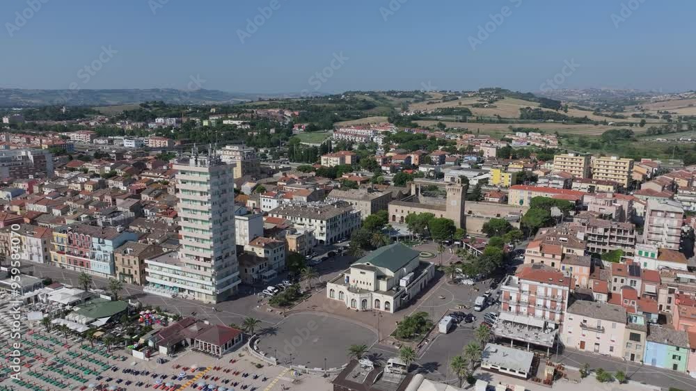 aerial flying in the Adriatic Sea into the colorful umbrella-laden beaches of vacation hotspot Porto Recanati, Italy aerial flying in the Adriatic Sea into the colorful umbrella-laden beaches of vacation hotspot Porto Recanati, Italy
