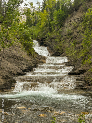 waterfall in the mountains photo