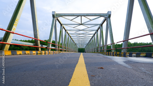 View From Below Of A Road With A Steel Truss Bridge In Belinyu Village, Indonesia photo