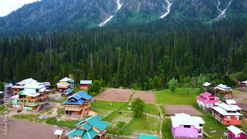 Breathtaking view of Arang Kel landscape with colorful houses in Kashmir, Pakistan. Drone shot. photo