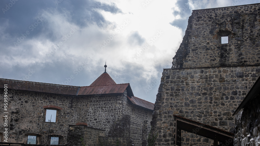 View of a zuzemberk castle, with partially renovated walls. View of a zuzemberk castle, with partially renovated walls.
