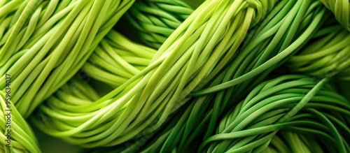 Rolled polyester cord in a variety of bright green shades Vertical image copyspace photo