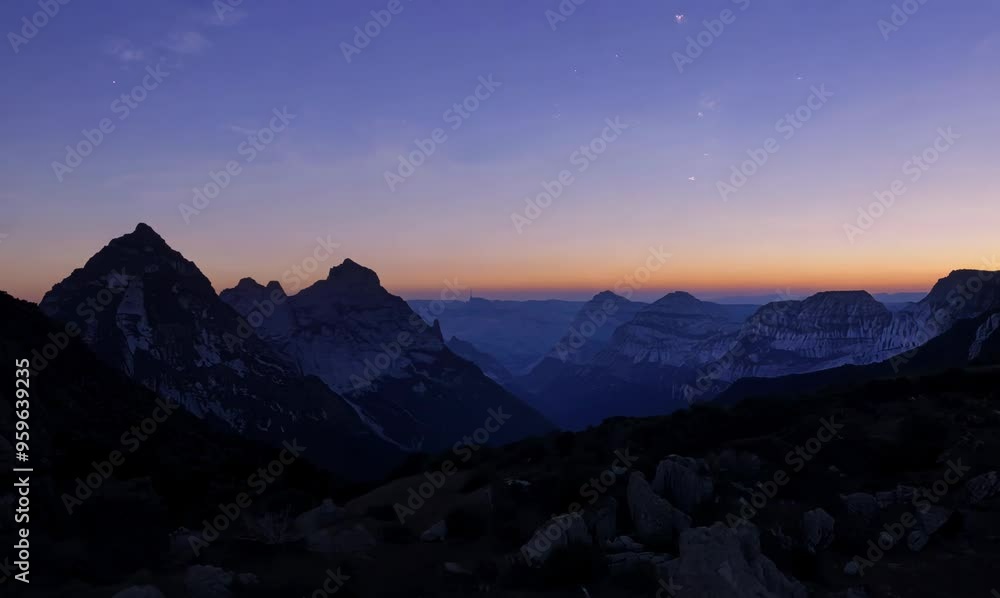 dramatic dusk view of mountain silhouettes under a twilight sky dramatic dusk view of mountain silhouettes under a twilight sky