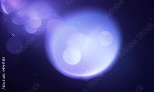 Abstract lens flare with optical glow and delicate bokeh particles transitioning on a dark backdrop.
