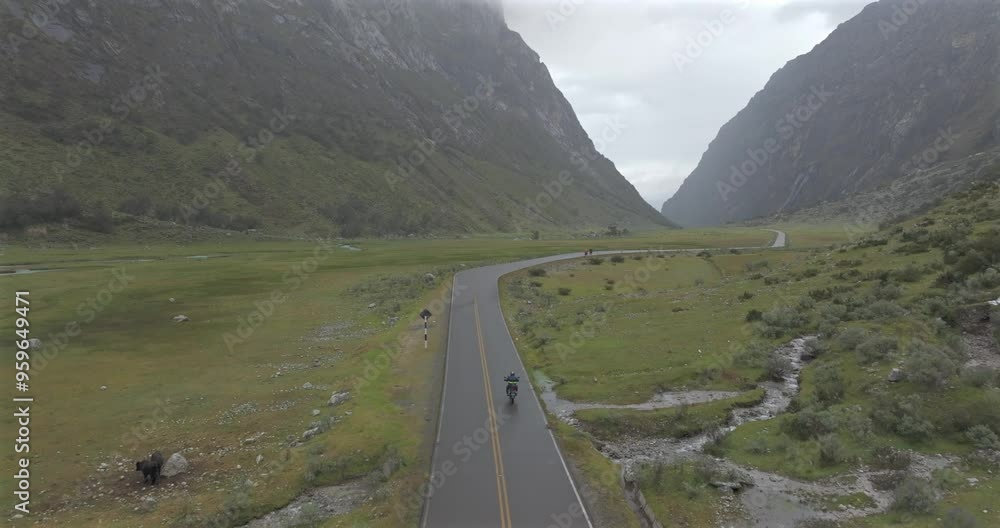 Aerial shot of adventure motorcycles riding on andes valley road Aerial shot of adventure motorcycles riding on andes valley road