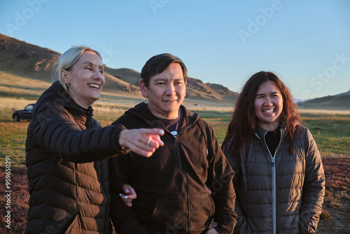 Three friends smiling and enjoying outdoor time photo