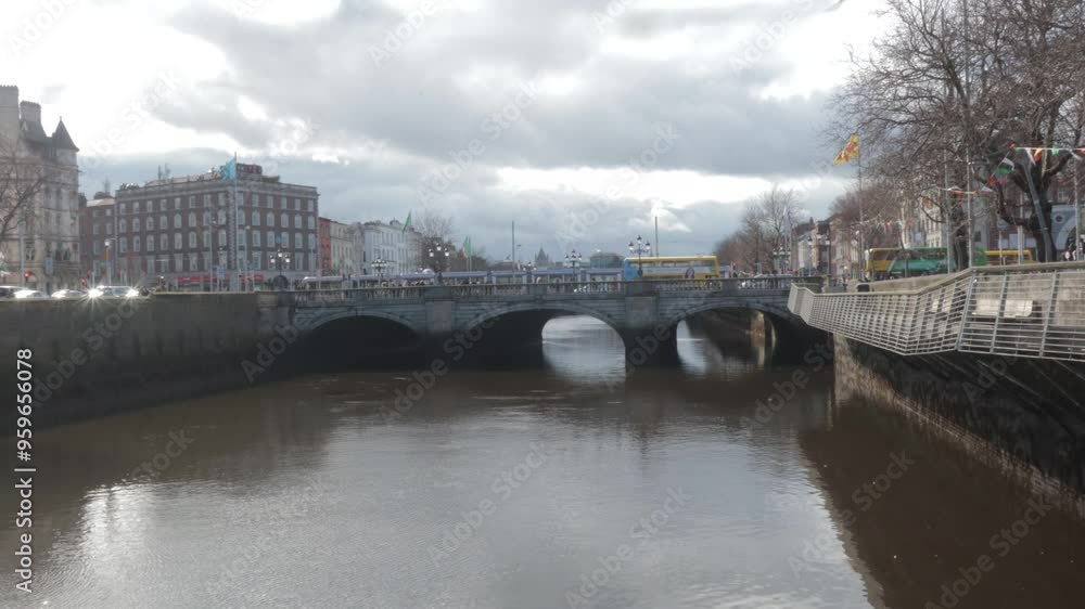 Timelapse of dublin centre with bridges and boats rushing on the river and public transport over the bridge time-lapse of O'Connell Bridge, Dublin, Ireland. Timelapse of dublin centre with bridges and boats rushing on the river and public transport over the bridge time-lapse of O'Connell Bridge, Dublin, Ireland.