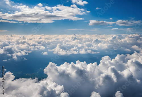 A sea of clouds stretches towards the horizon in a breathtaking aerial view.