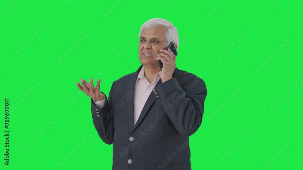 Indian senior manager talking on phone Green screen Indian senior manager talking on phone Green screen