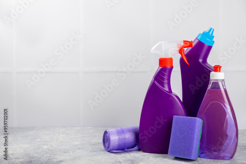 Cleaning service concept.Home cleaning product on a pink background. Bucket with household chemicals. cleaning supplies for home or office space.Early spring regular cleaning. Copy space