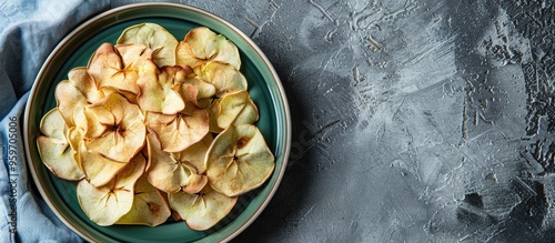 Healthy apple chips on a ro...