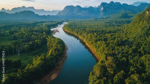 Aerial perspective of the serene Hin Boun River, with its karst landscapes and dense forests in central Laos. photo