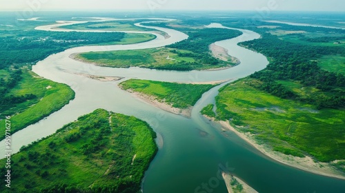 Aerial shot of the winding channels of the Mekong River at Kratie, with green islands and sandy banks.