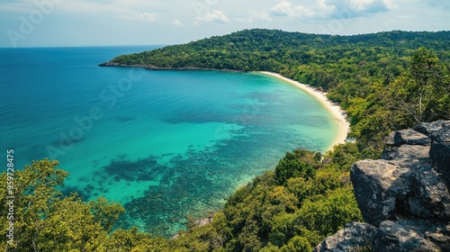 Top view of Koh Thmei, with its turquoise waters, sandy beaches, and dense forests teeming with wildlife. photo