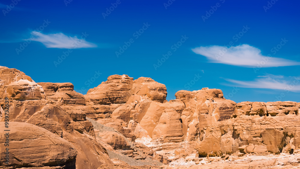 peaks of high stone rocks against a blue sky in Egypt Dahab South Sinai peaks of high stone rocks against a blue sky in Egypt Dahab South Sinai