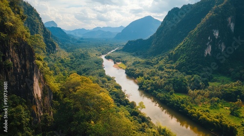 Top view of the towering limestone cliffs of Nong Khiaw, with the Nam Ou River winding through the verdant valley. photo