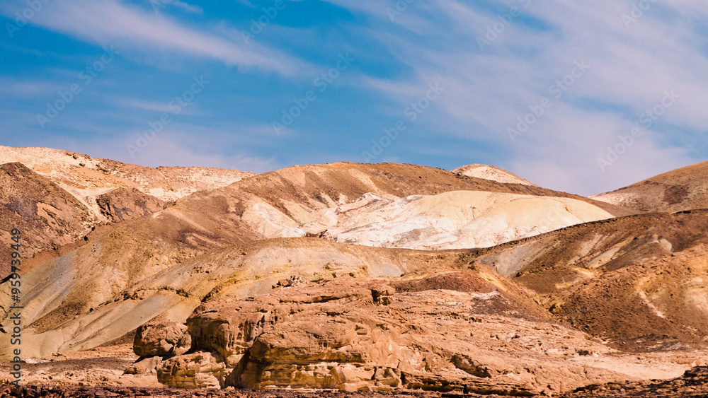 high rocky mountains against the blue sky and white clouds in the desert in Egypt Dahab South Sinai high rocky mountains against the blue sky and white clouds in the desert in Egypt Dahab South Sinai