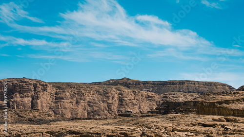 high rocky mountains in the desert against the blue sky and white clouds in Egypt Dahab South Sinai