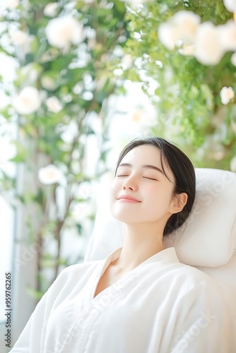 A natural beautiful woman relaxing on massage bed in spa